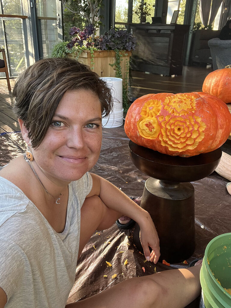 Marlene Hild with one of her carved pumpkins