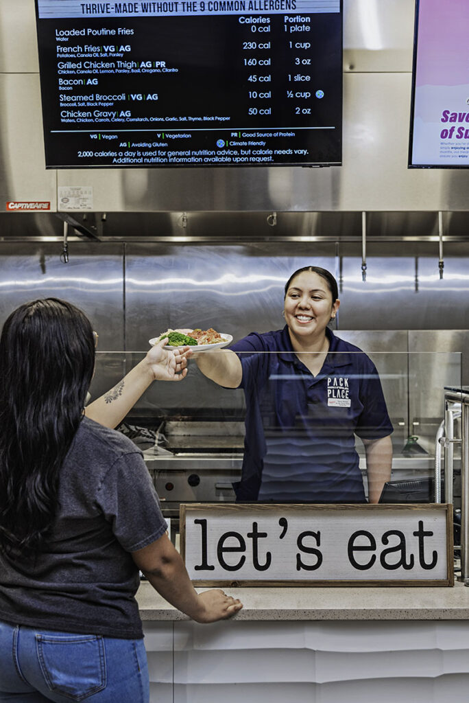 Nancy Roman, assistant director of residential dining, serves a plate of food