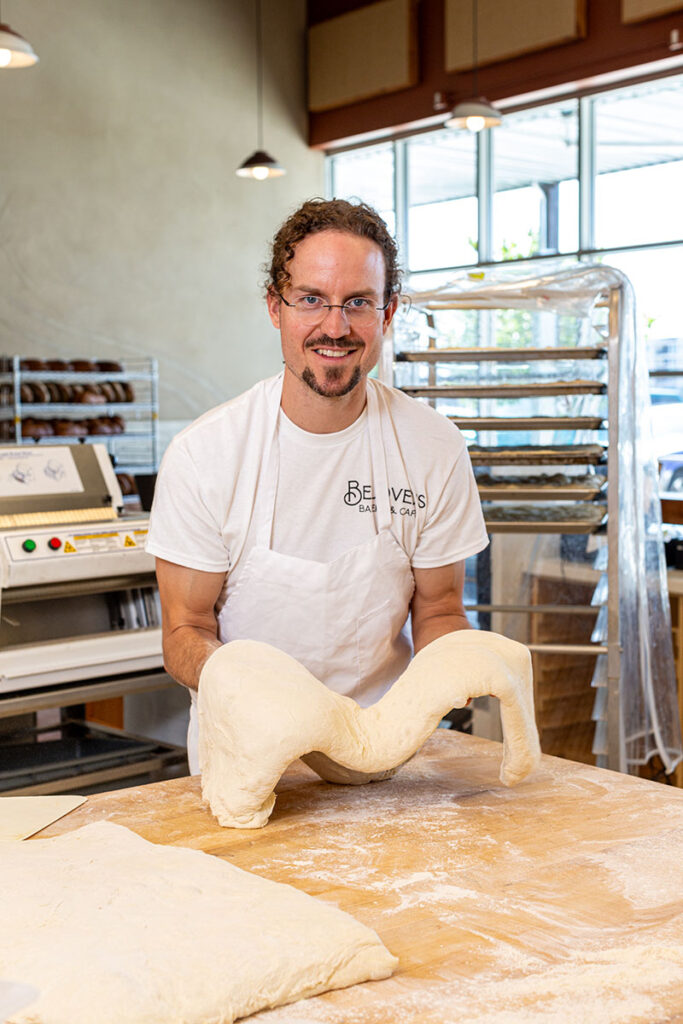 Zach Condron, Beloved's owner, shapes focaccia bread. Photo by Olga Miller