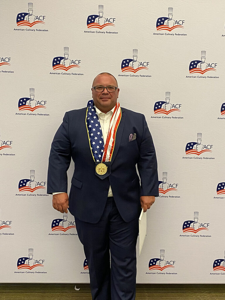 Jay Rathmann wears his Presidential Medallion