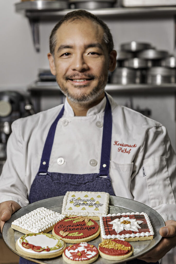 Kevin Futamachi, owner of Sweet Escapes Bakes, presents a tray of his holiday cookies