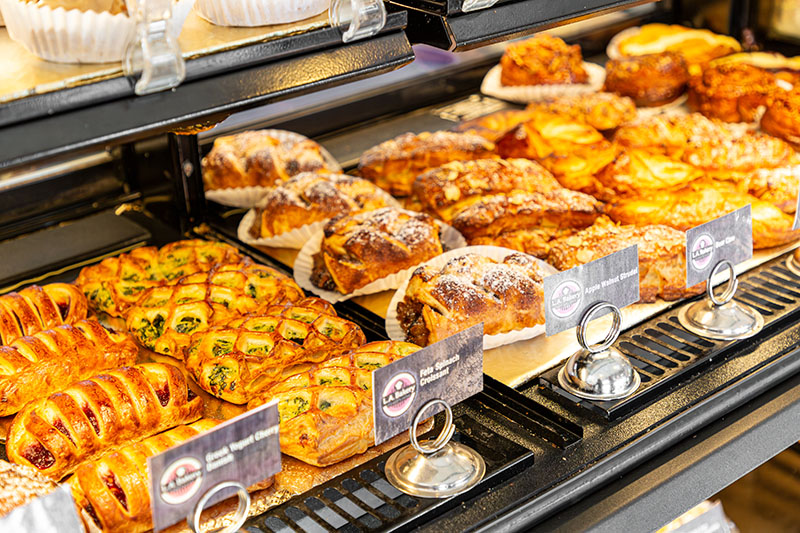 A bakery case full of house-made croissants, strudel, and other pastries from L.A. Bakery. Photo by Olga Miller