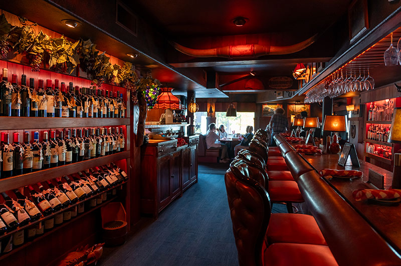 Bar interior at Old Range Steakhouse, featuring its extension wine collection