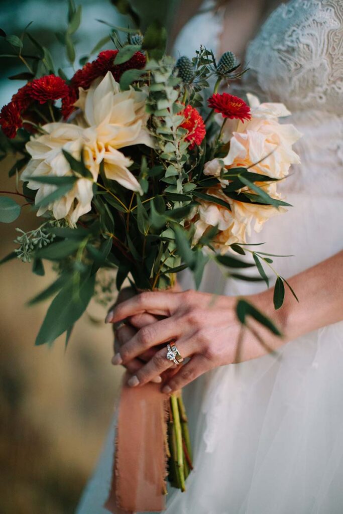 Bride Jenna Hulbert at Nakoma Resort. Dress by Swoon Bridal. Florals by Timberline Flower Farms. Photo by Courtney Aaron