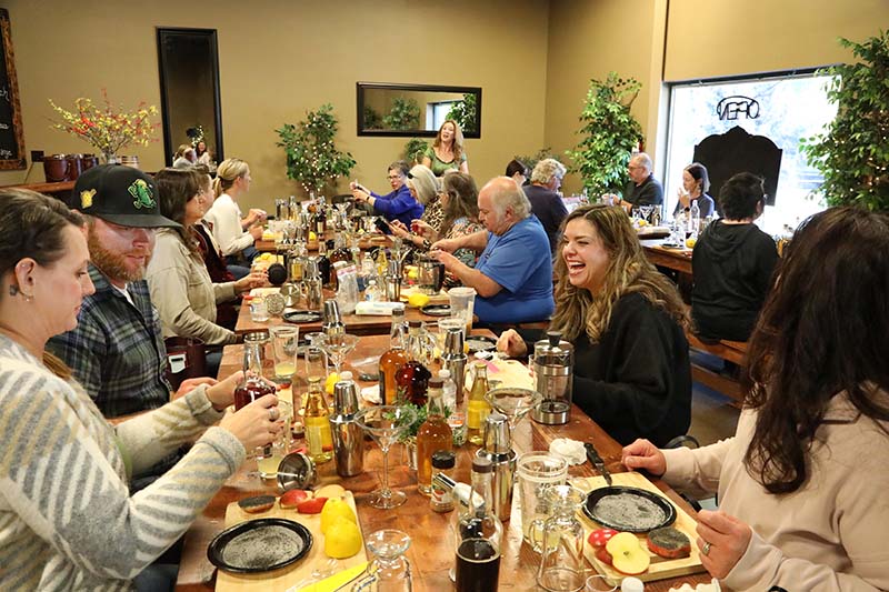 Felicia Keith-Jones instructs a cocktail-mixing class at High Mark Distillery