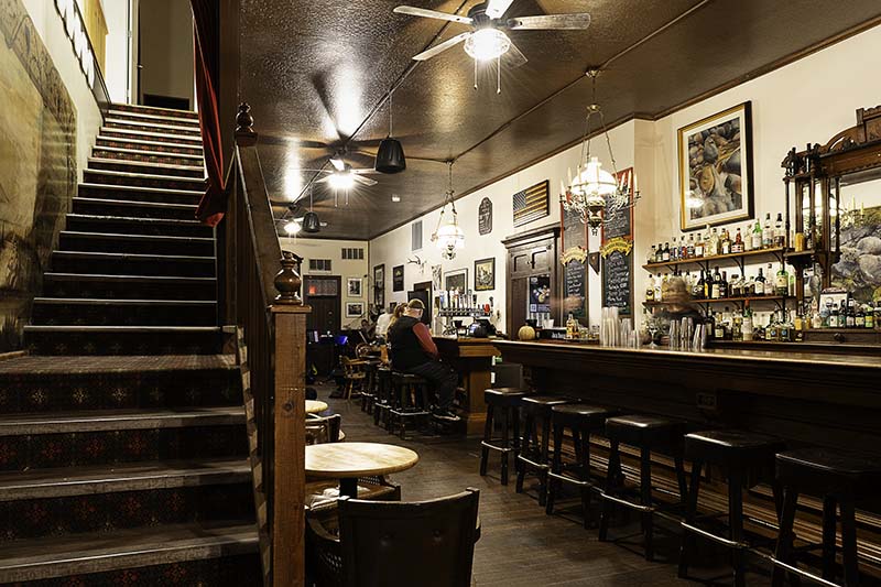 View of the bar at Odeon and stairs to the oldest theater hall in Nevada