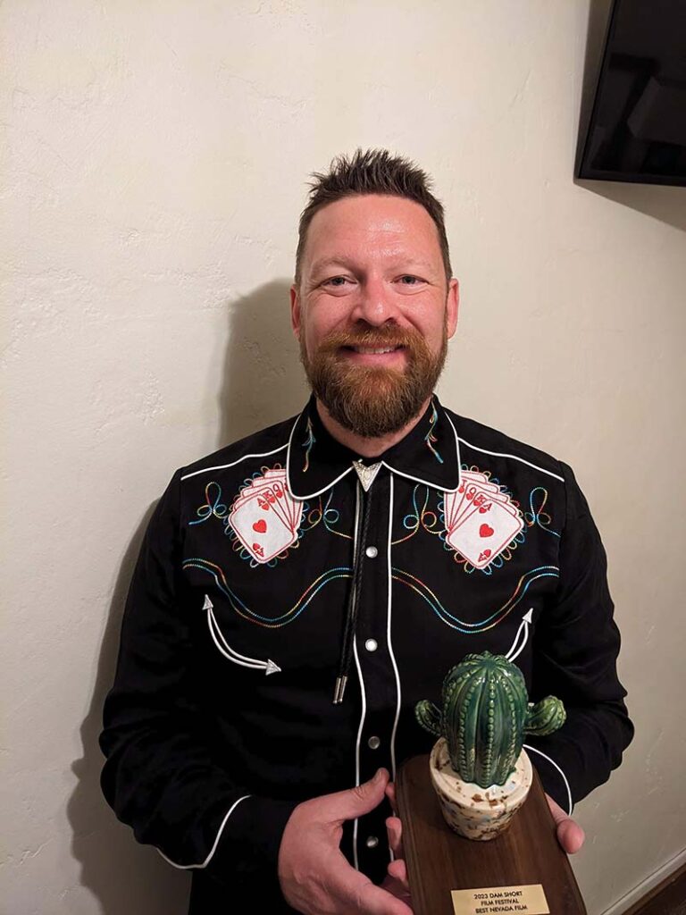 Mark Maynard with the Best Nevada Film trophy at the 2023 Dam Short Film Festival