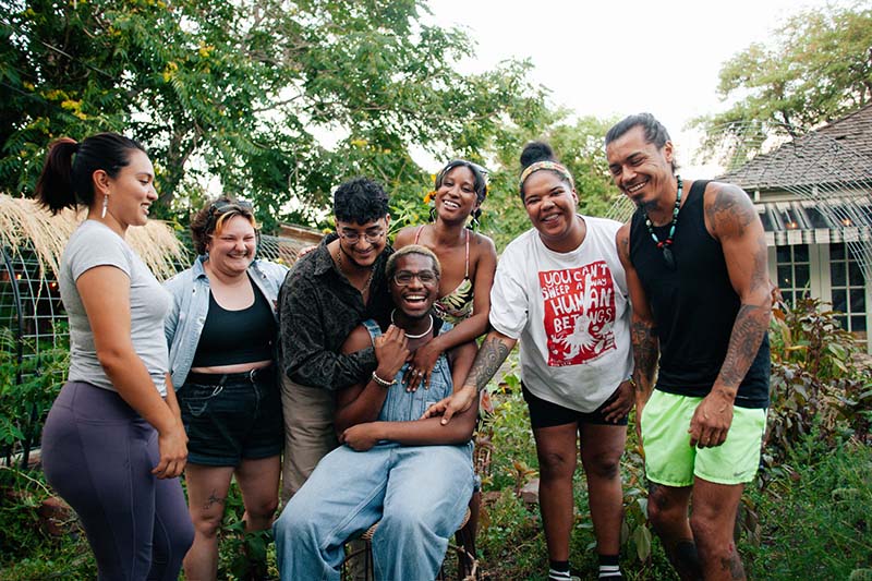 A group at Hampton House Garden Project builds community with a dash of fun. From left, standing: Elena D., Ren, Ruben R., Morgan M., Lily B., Orlando O. Sitting: Evan R.