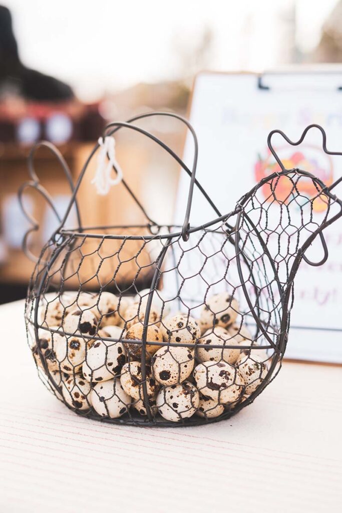 A wire basket of quail eggs. Photo by Yashila Photography