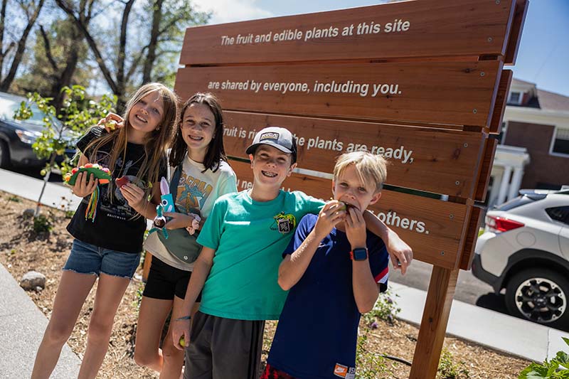 From left, Laura Baur, Ardyn Williams, Jameson Williams, and Ryan Tate help out in the Nevada Museum of Art garden/art exhibit. Photo courtesy of Nevada Museum of Art