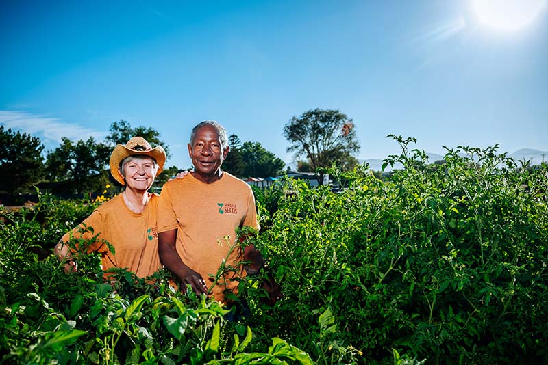 Dolores (Dee) Schafer-Whitten and Earstin Whitten, cofounders of Soulful Seeds, stand by their pepper and tomato plants