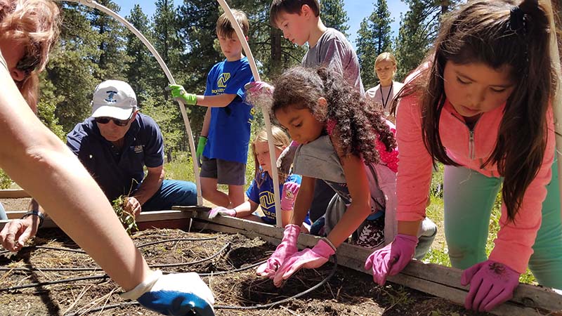 Students with the Boys & Girls Club help plant the demonstration garden. Photo courtesy of UC Davis Tahoe Environmental Research Center