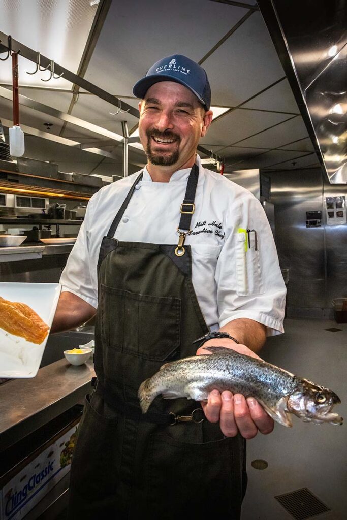 Executive chef Matt Hale of Six Peaks Grille at Everline Resort prepares a guest’s freshly caught rainbow trout. Photo by Scott Thompson