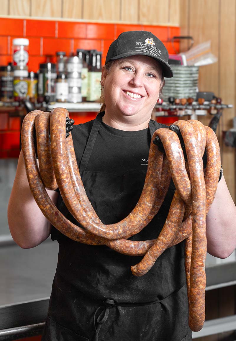 Shelbe Seay holds a lasso of Basque chorizo sausage