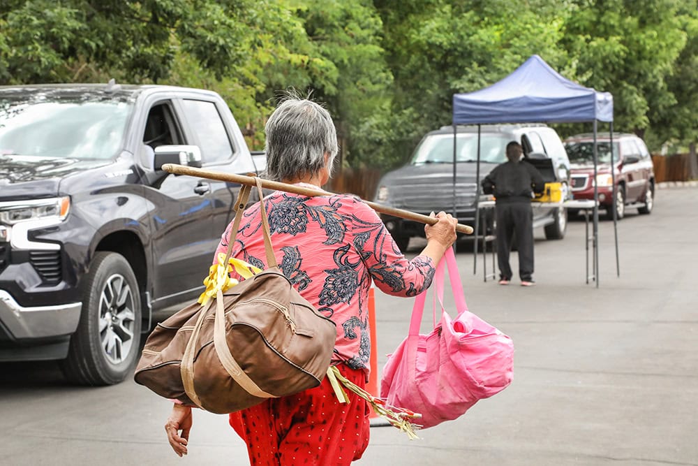 A neighbor finds an inventive way to bring her fresh produce home from the Food Bank of Northern Nevada Mobile Harvest Program event