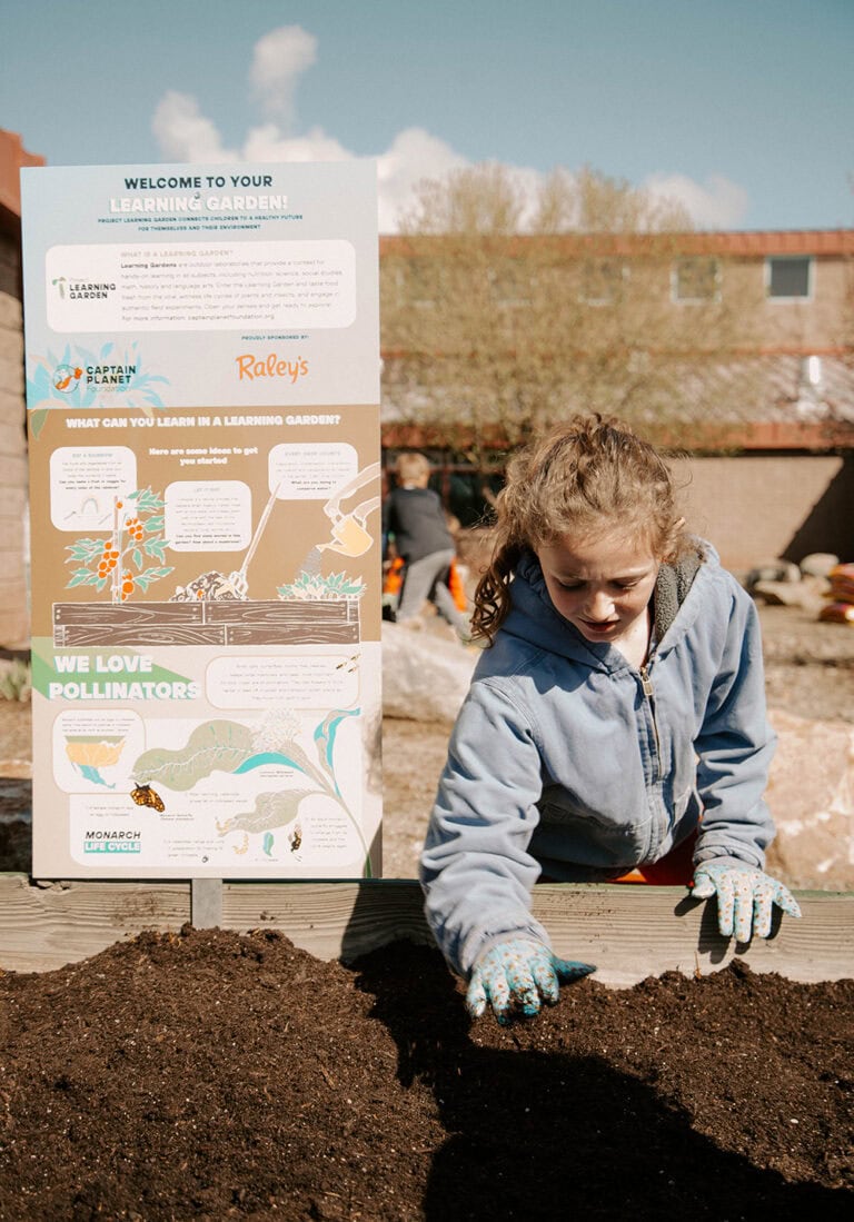 A student at Alyce Taylor Elementary plants seeds and starts in raised beds. Photo courtesy of The Raley’s Companies