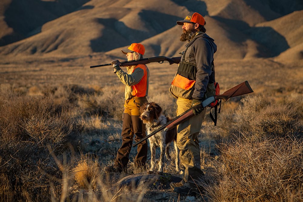 Bubba Henderson and a family member hunt quail in the back country of Yerington. Photo by Tom Rassuchine