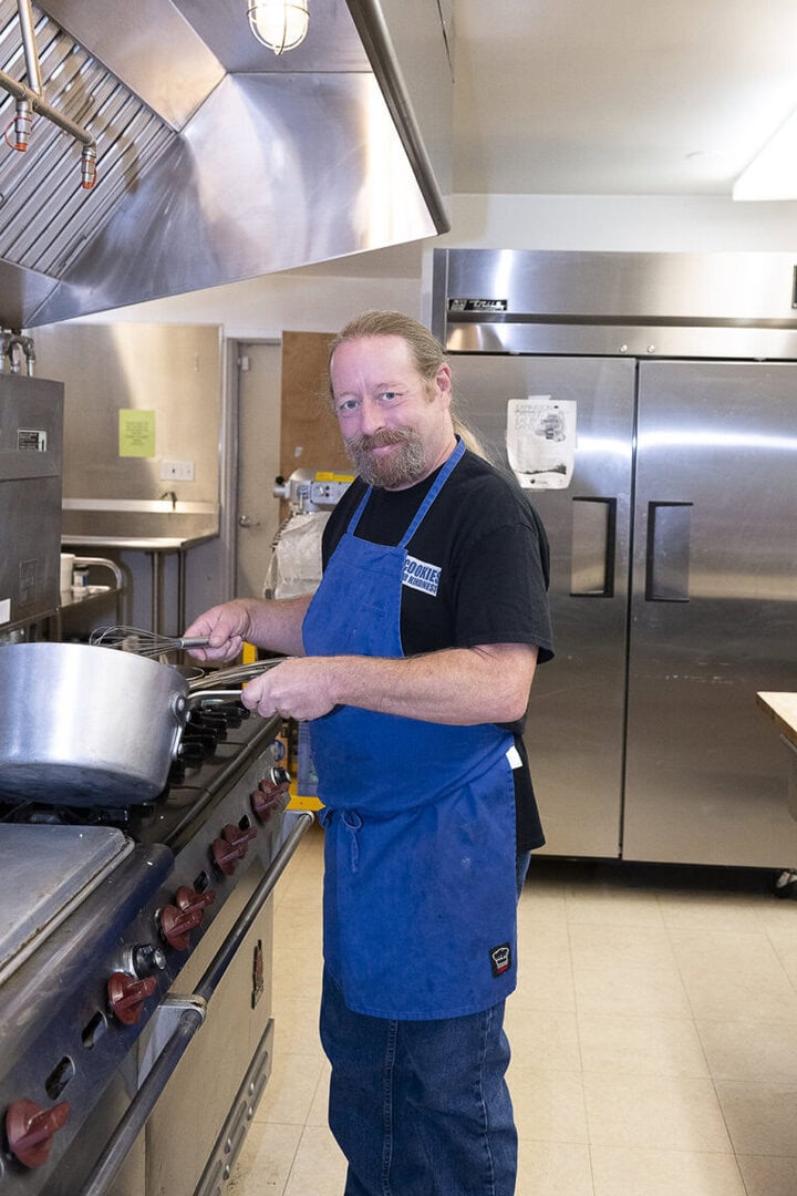 Thomas Hill, kitchen manager at the church, prepares meals for hundreds of area residents. Photo by Mary Claire Bouchér