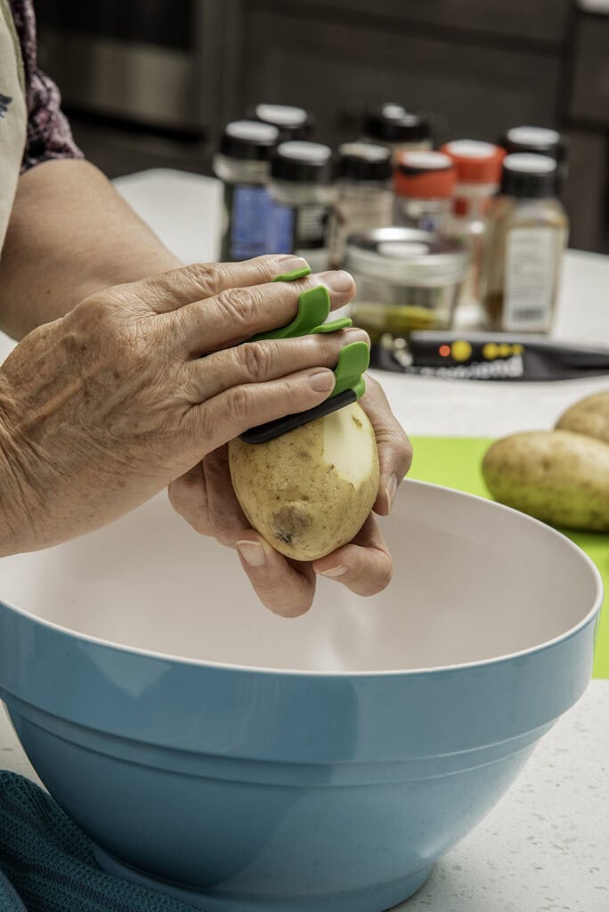 Edgcomb uses a palm peeler, which is easier to grip for those with dexterity issues