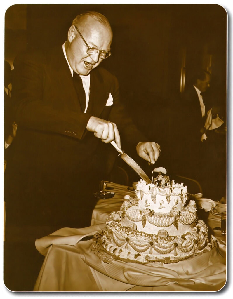 Roy H. Bergstrom, the club’s first president, cuts the first birthday cake in 1948