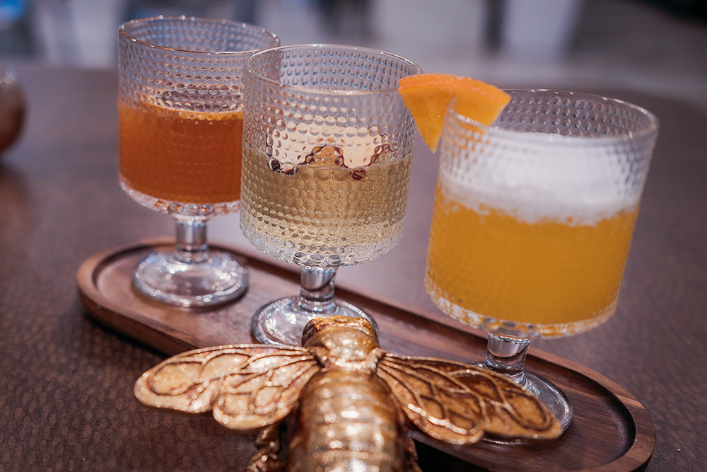 A mimosa flight features, from left, creamsicle, fall over, and sunrise mimosas