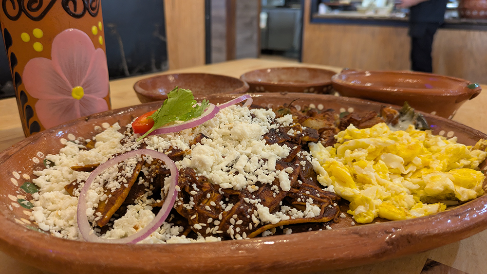 A breakfast of mole chilaquiles with beans, potatoes, and eggs doused with red and green sauce is a wonderful way to jump-start your morning
